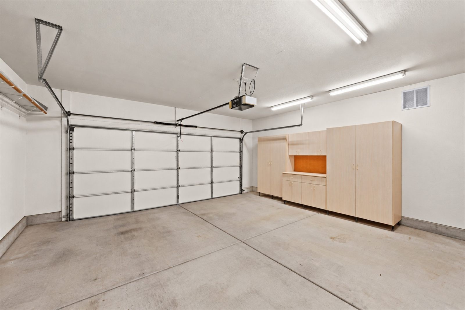 Clutter removal example, garage after boxes and bins were digitally removed