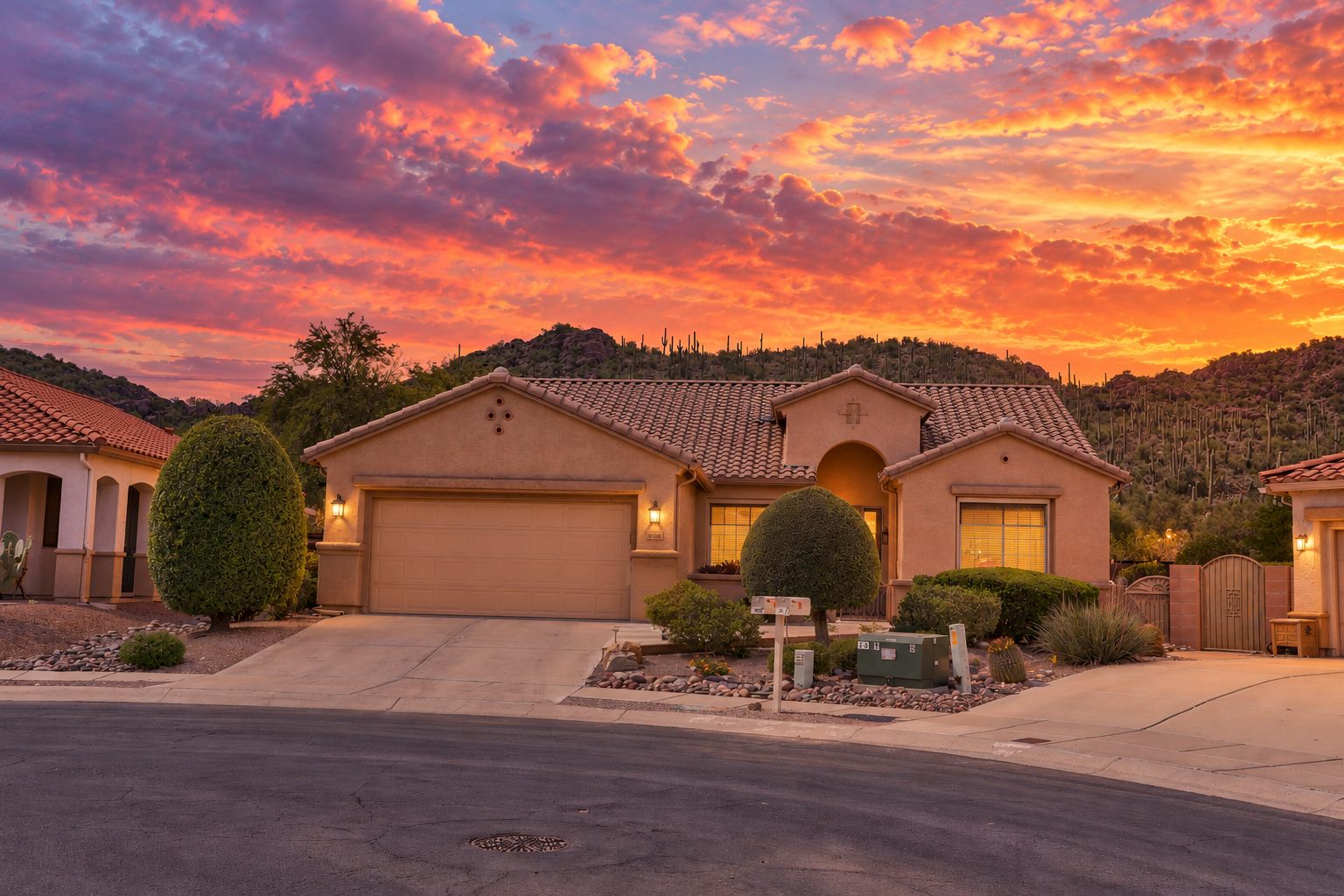 Front of a Tucson home at twilight under a colorful sky